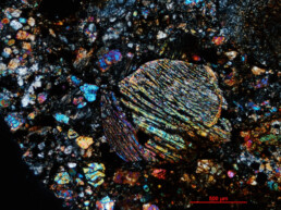 Photomicrograph of a chondritic meteorite, believed to originate from the Asteroid Belt. These meteorites are amongst the oldest know objects in the Solar System, dating back 4.56 billion years, and are the building blocks for the terrestrial planets. Credit: Anthony Kemp, UWA.